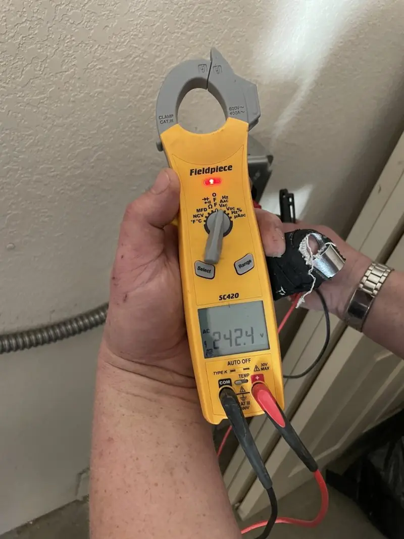 Voltage testing with clamp meter during Recessed Lighting Installation in Bagdad